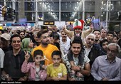 Heroes Return: Iranian Wrestling Champions Greeted by Throngs at Tehran Airport