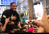 Heroes Return: Iranian Wrestling Champions Greeted by Throngs at Tehran Airport