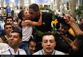 Heroes Return: Iranian Wrestling Champions Greeted by Throngs at Tehran Airport