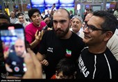 Heroes Return: Iranian Wrestling Champions Greeted by Throngs at Tehran Airport