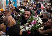 Heroes Return: Iranian Wrestling Champions Greeted by Throngs at Tehran Airport