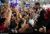 Heroes Return: Iranian Wrestling Champions Greeted by Throngs at Tehran Airport