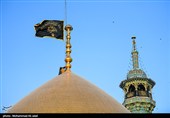 آیین تعویض پرچم گنبد حرم مطهر حضرت معصومه (س)